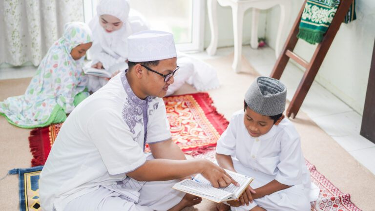 asian muslim families read quran after prayers