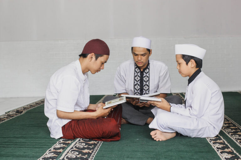 group male muslim teenagers who fill their spare time by taking turns reading koran mo