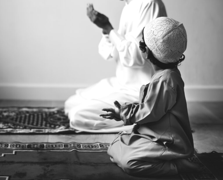 muslim boy learning how make dua allah
