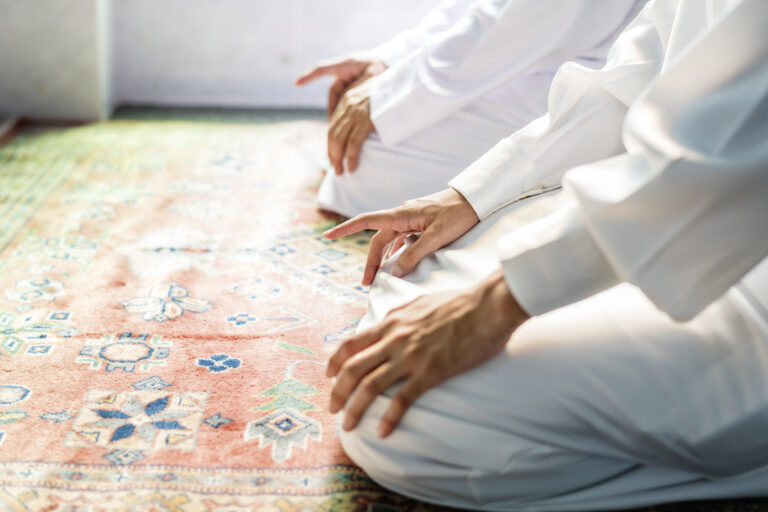 muslim men praying tashahhud posture