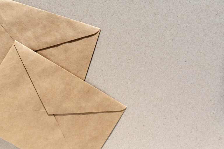 paper envelopes brown background with copy space