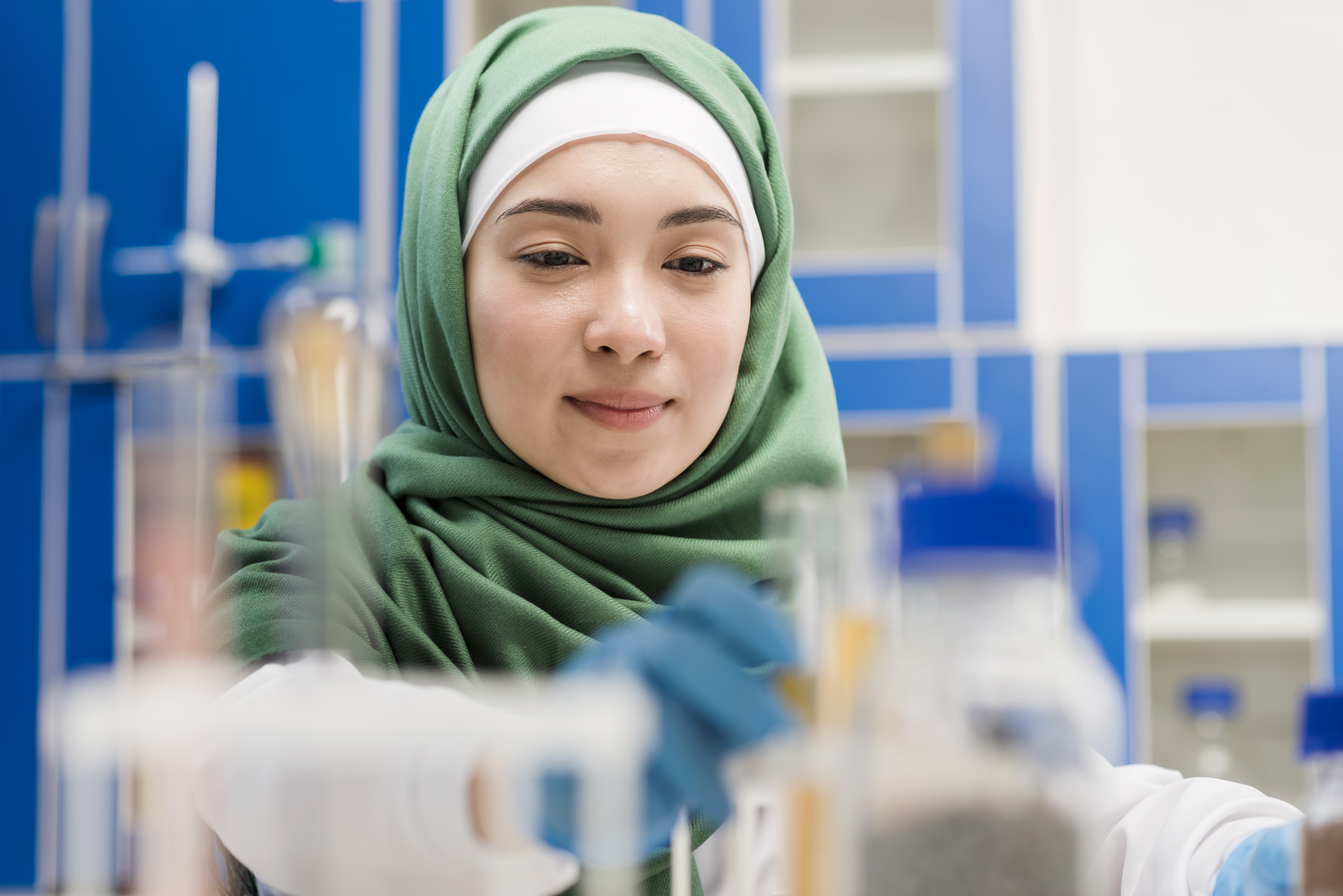 front view female scientist with hijab lab