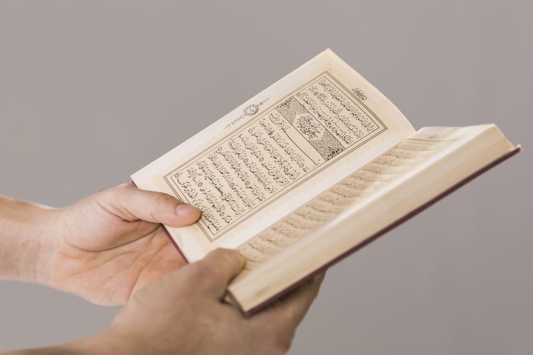 quran being held hands close up