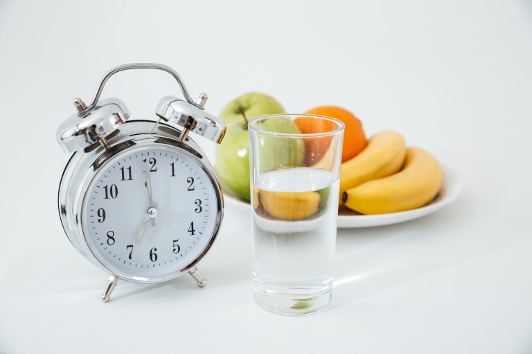 alarm glass water near fruits